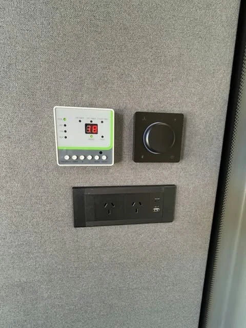 Control panel, rotary control, power outlets and USB ports inside the air-conditioned FocusPod Max.